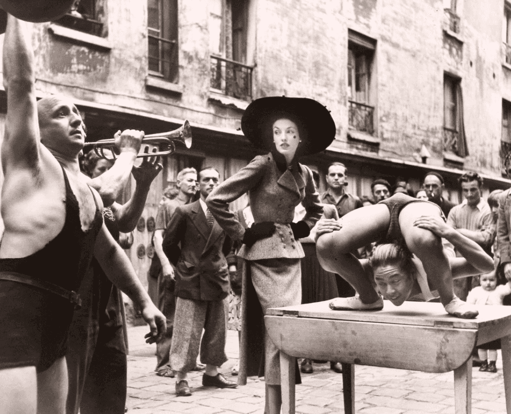 Richard Avedon, ‘Elise Daniels with Street Performers’, 1948, Print, Silver Gelatin Print, null, Numbered, Dated