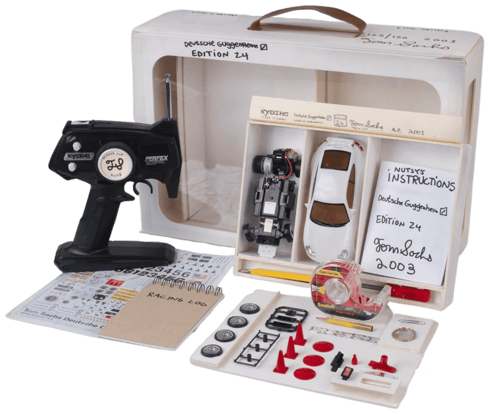 Tom Sachs, ‘Nutsy Deluxe Racing Set’, 2003, Sculpture, Foamcore, scotch tape, knife, notebook, bottle cap, lug wheel wrench, custom sticker pack, antenna, paper-clip, Deutsche Guggenheim, Numbered