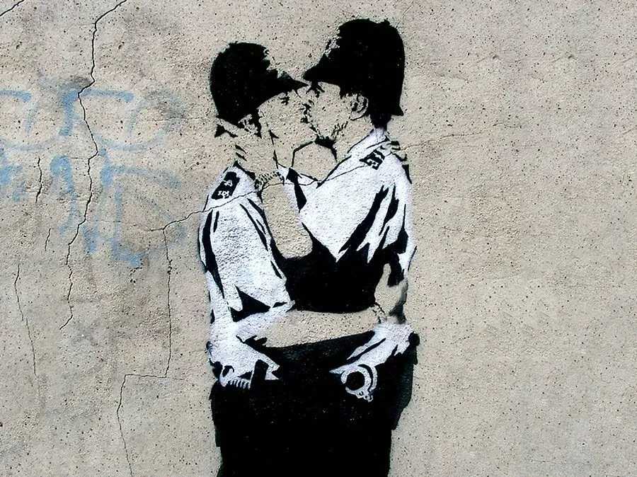Kissing Coppers was originally spray-painted on the side of the Price Albert Pub in Brighton, UK | © Banksy