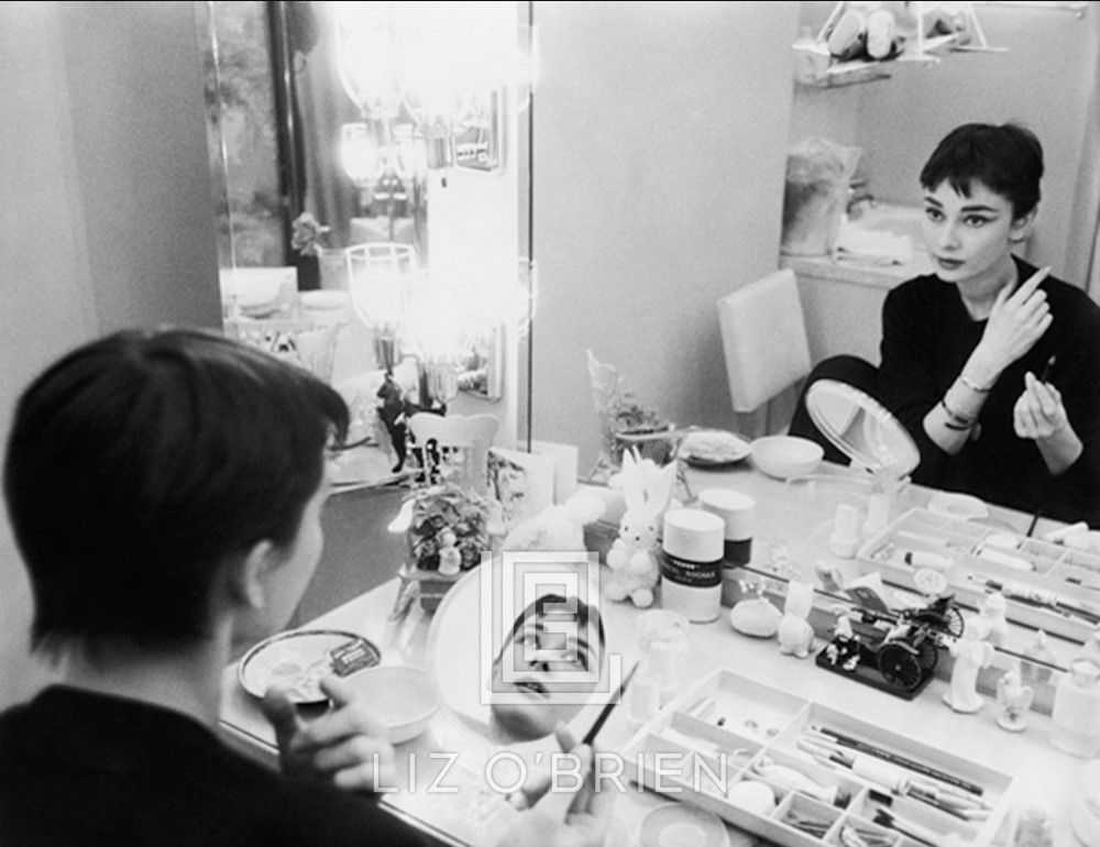 Mark Shaw, ‘Audrey Hepburn Applies Makeup in Two Mirrors Back Stage At Ondine 1954’, 1954, Print, Pigment print on Hahnemϋhle photo rag paper, null,