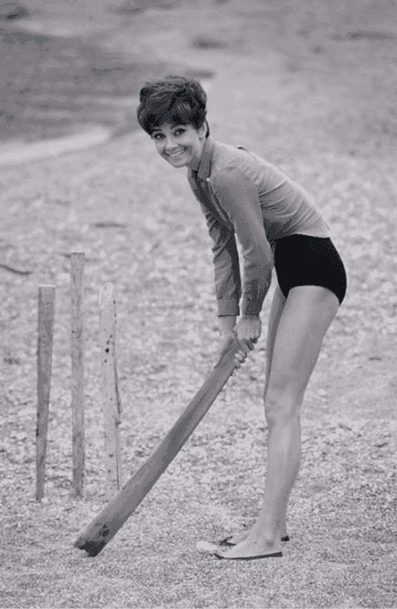 Terry O'Neill, ‘Audrey Hepburn Plays Cricket on the Beach During a Break from Filming Stanley Donen's 'Two for the Road'’, 1967, Photography, Gelatin silver on fibre-based paper, null,