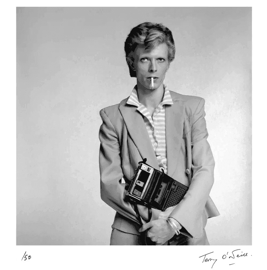 Terry O'Neill, ‘David Bowie holding a Cassette Player’, 1974, Photography, Posthumous Edition: Gelatin Silver Print, null,