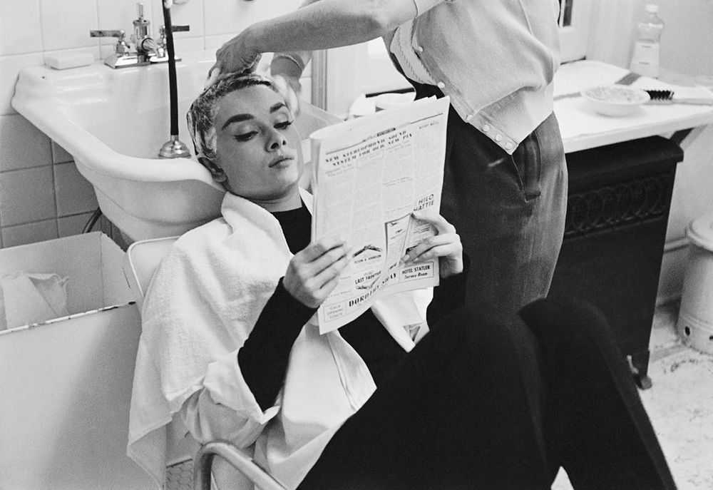 Mark Shaw, ‘Audrey Hepburn Getting Shampooed and Reading 1953’, 1953, Print, Pigment print on Hahnemϋhle photo rag paper, null,
