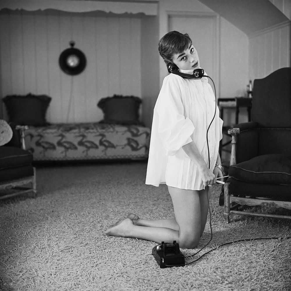 Mark Shaw, ‘Audrey Hepburn in White Blouse With Phone, Kneeling, 1953’, 1953, Print, Pigment print on Hahnemϋhle photo rag paper, null,