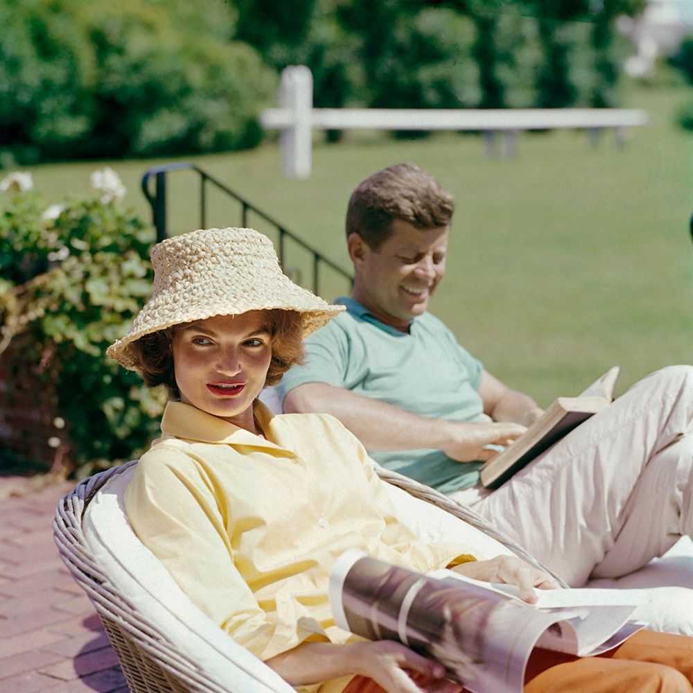 Mark Shaw, ‘Kennedys, Jackie in Straw Hat, JFK Reading, 1960’, 1960, Print, Pigment print on Hahnemϋhle photo rag paper, null,