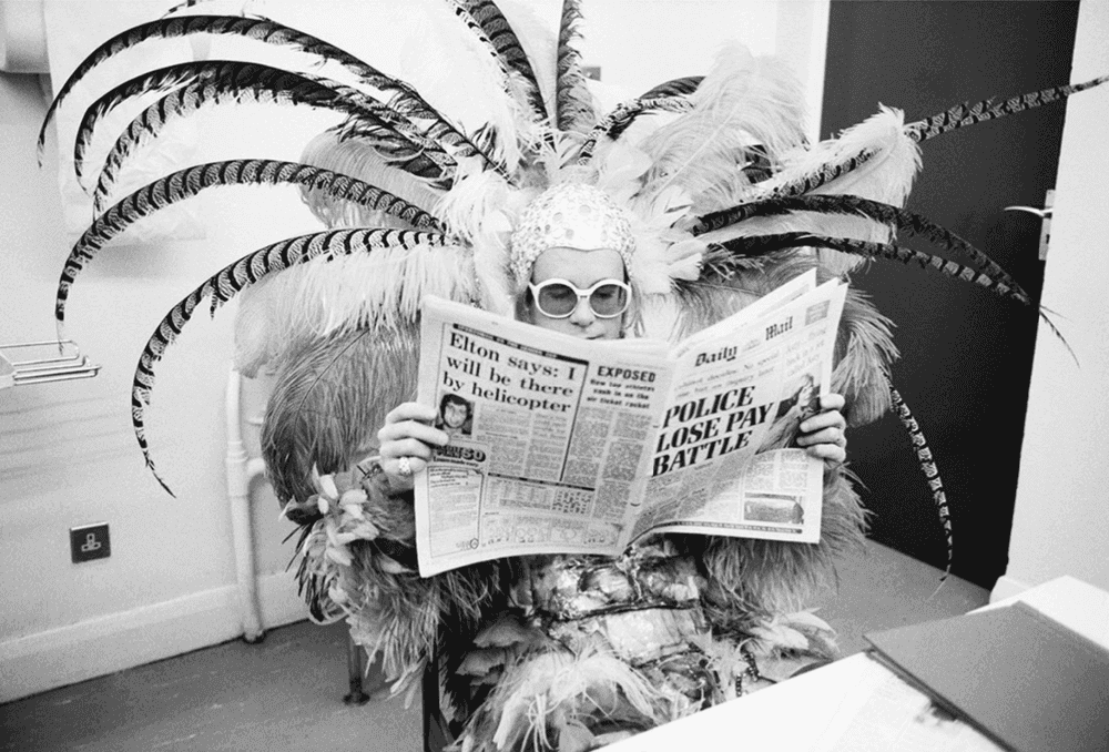 Terry O'Neill, ‘Elton John Newspaper’, 1977, Photography, Posthumous Edition: Gelatin Silver Print, null,